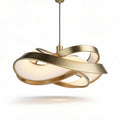 Modern gold metal pendant light fixture with abstract design and white glass shade
